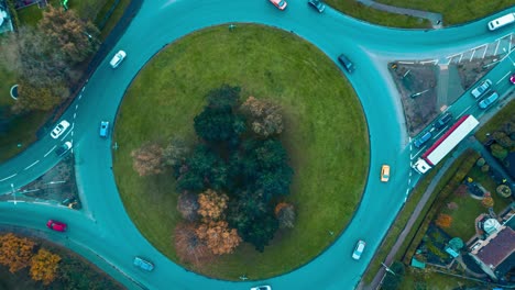 Ascending-drone-shot-of-a-roundabout-in-the-town-of-Thetford,-located-in-Breckland,-Norfolk-in-United-Kingdom