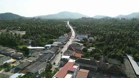 Aerial-View-of-Traffic-Driving-on-Main-Road-in-Tropical-Koh-Samui-Town,-Thailand