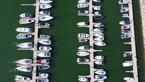 Endless-number-of-yachts-and-sailboats-in-local-pier,-aerial-top-down-view