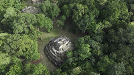 Famous-maya-ruins-at-Yaxha-in-middle-of-jungle-Guatemala,-aerial