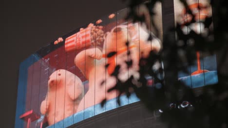 Advertisement-Billboards-on-Shibuya-Crossing-at-Night,-Tokyo,-Japan