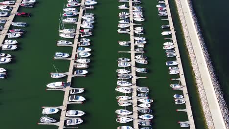 Lines-of-boat-in-beautiful-pier,-aerial-drone-view