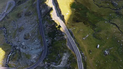 Forward-aerial-shot-of-rocky-serpentine-mountain-road