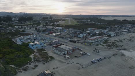 Aerial-Drone-shot-of-Pismo-Beach-California-Airport-and-Town-at-Sunrise