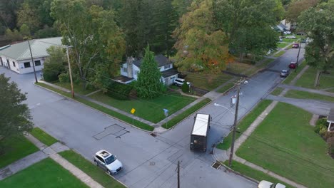 UPS-delivery-truck-driving-in-American-neighborhood