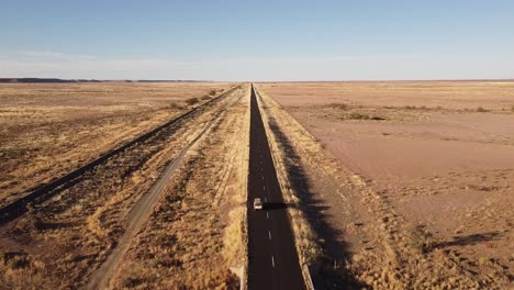 Adventure-Across-Endless-Dunes:-4K-drone-shot-of-Desert-Drive-in-Namibia,-Africa-with-Rooftop-Tented-4x4-Toyota-Hilux