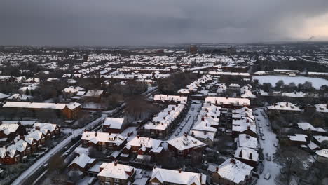 Aerial-of-snow-covered-houses-in-North-East-England,-Newcastle-Upon-Tyne-at-Sunrise