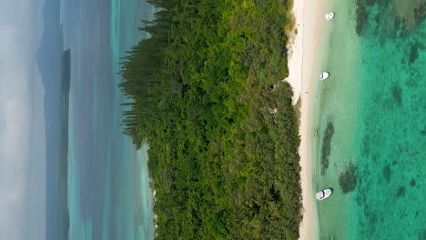 Aerial-vertical-shot-circling-above-Ilot-Moro,-a-paradisiac-islet-off-Isle-of-Pines,-New-Caledonia