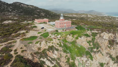 Faro-di-Capo-Spartivento,-Sardinia:-wonderful-aerial-view-travelling-out-to-the-fantastic-Lighthouse-of-the-island-of-Sardinia