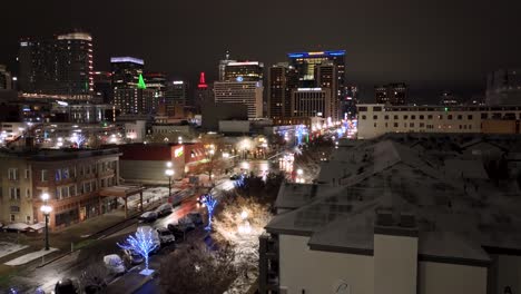 Salt-Lake-city-at-nighttime---city-skyline-and-Christmas-lights-ascending-aerial-view
