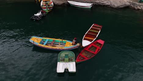 Aerial-View-Of-Colourful-Row-Boats-Tied-Together-Floating-On-Upper-Kachura-Lake,-Skardu