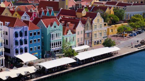 Handelskade-Punda-District-Willemstad-Curacao-shops-with-white-outdoor-seating-coverings