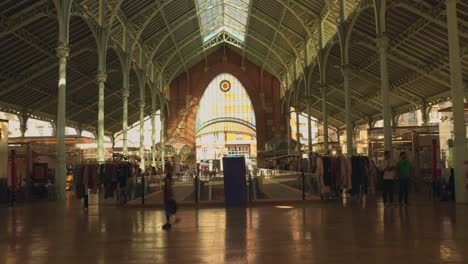 Pan-shot-of-internal-area-of-Colón-Market,-Historic-landmark-in-Valencia,-Spain