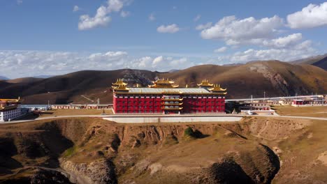 Royal-red-palace-with-gold-trim-in-Tagong-grasslands,-Tibetan-Sichuan-Western-China