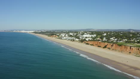 Drone-view-of-Algarve-beach,-Almancil,-Portugal