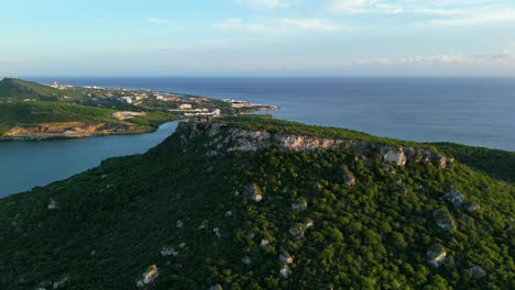 Drone-dolly-push-past-Jack-Evertzberg-to-reveal-Piscadera-Curacao-at-sunrise