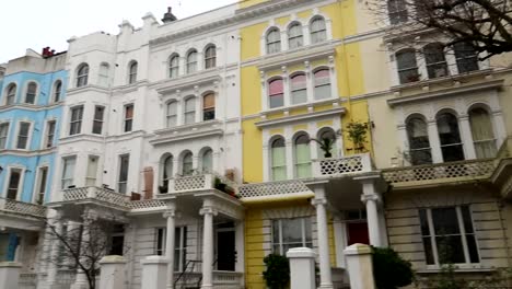 Brightly-colored-Victorian-facades-in-Colville-Terrace,-Notting-Hill,-London