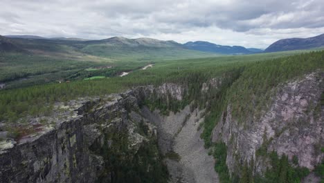 The-lush-Nordic-Landscape-the-surrounds-the-Jutulhogget-canyon-is-displayed-in-this-drone-shot