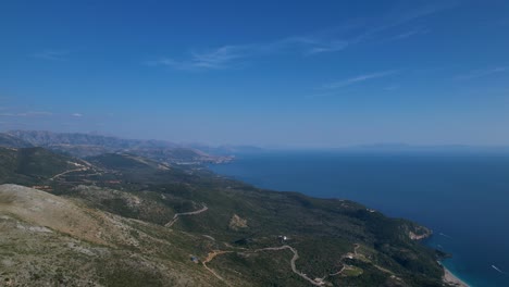 Seaside-of-the-Albanian-Riviera-Unfold-from-the-Mountain,-Overlooking-the-Sparkling-Ionian-Sea