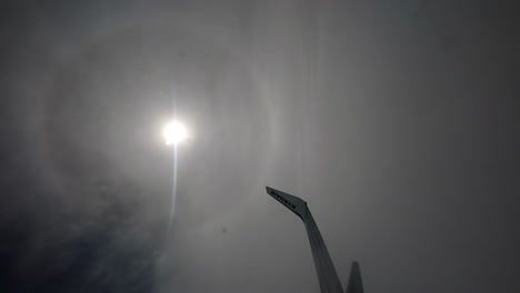 Ryanair-plane-wing-with-logo-in-the-moon-light-reflexion-in-foggy-sky