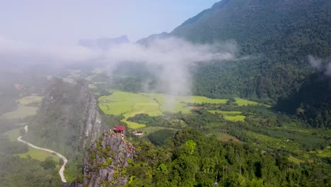 Aerial-View-Of-Nam-Xay-Viewpoint-In-Vang-Vieng,-Laos-On-Clear-Day-With-Clouds-Above