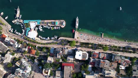 Top-Down-View-Showcasing-a-Collection-of-Boats-and-Yachts-Gracefully-Docked-on-the-Picturesque-Pier-of-Saranda