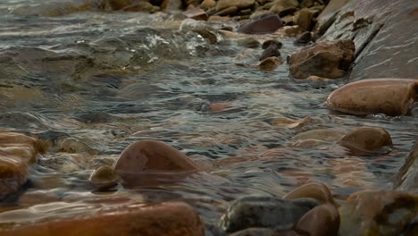 Water-Waves-Over-Rocks-On-A-Lake---Slow-Motion