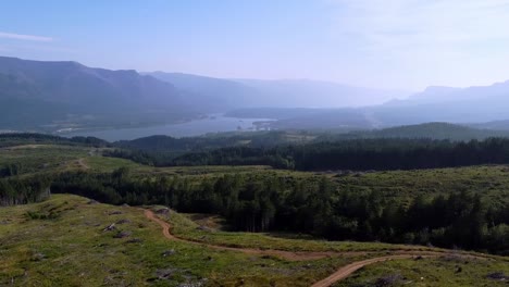 Scenic-Aerial-Overlook-of-the-Columbia-River-Gorge-with-Mount-Hood-peeking-in-the-distance