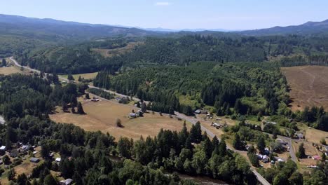Drone-Flying-over-Road-in-Rural-Washington-State,-Pe-Ell