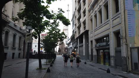 People-walk-in-cobblestone-streets-of-San-Telmo-Vintage-Buenos-Aires-City-Town-Argentina-Neighborhood