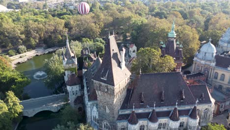 Aerial-view-over-impressive-Vajdahunyad-Castle-in-Budapest-City-Park,-Hungary