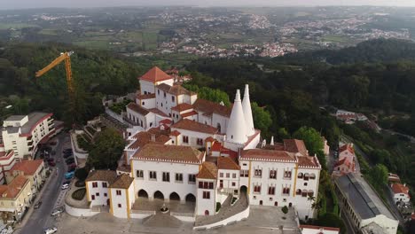 National-Palace-In-The-Historical-Town-Of-Sintra,-Portugal---aerial-drone-shot