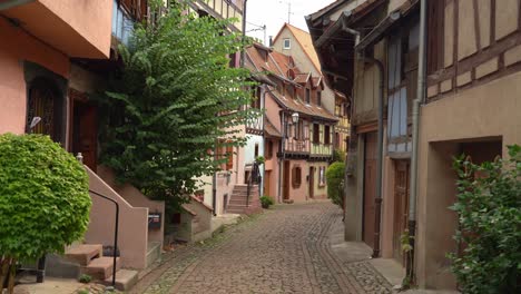 Eguisheim-has-picturesque-cobbled-streets-admiring-colorful-houses-with-pointed-roofs-and-timber-framed-facades-which-makes-visitors-feel-like-in-a-real-life-fairytale