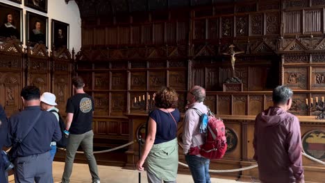 Panning-shot-showing-asian-and-german-tourist-visiting-famous-Hall-of-Peace-in-Münster-City,-Germany