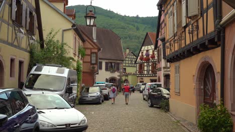 A-tourist-hotspot-of-Kayserberg-Village,-the-little-city-houses-some-of-the-most-beautiful-half-timbered-houses-of-the-Renaissance-in-Alsace-in-its-entirely-pedestrian-centre