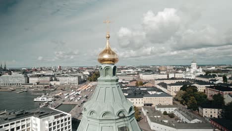 drone-orbiting-close-around-top-of-Uspenski-cathedral,-Helsinki,-finland