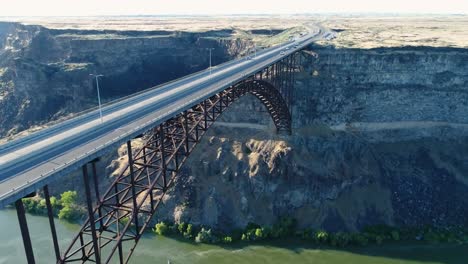A-4K-fly-over-drone-shot-of-Perrine-Bridge,-a-1,500-foot-long-bridge,-spanning-over-the-Snake-River-in-Twin-Falls,-Idaho