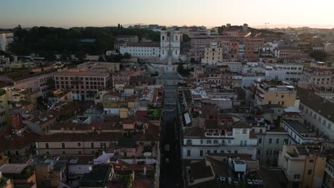 Beautiful-Drone-Shot-Above-Via-Condotti,-Famous-Spanish-Steps,-Trinita-dei-Monti-Church
