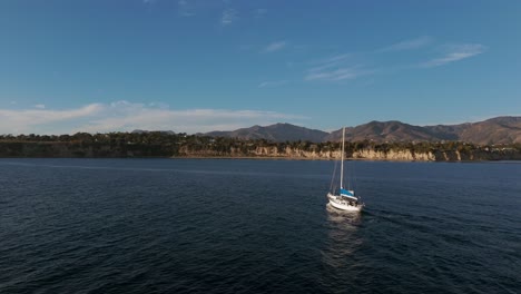 Boat-floating-off-the-coast-of-Malibu,-California