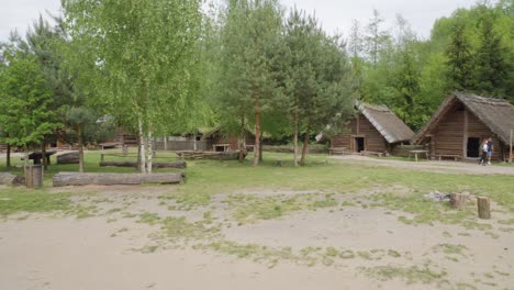 Ancient-Wooden-Slavic-Houses-in-Biskupin,-Poland---Pan-left-shot