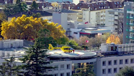 A-helicopter-crew-boards-a-rescue-helicopter-at-the-heliport-of-the-hospital-in-Merano-on-a-sunny-but-windy-autumn-day