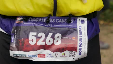 Bib-Number-detail-at-Grand-Trail-des-Templiers,-Millau,-France