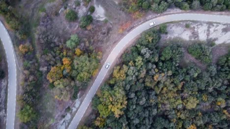 Birds-eye-view-cars-driving-on-a-mountain-road-in-Catalonia