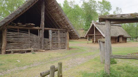 Ancient-Wooden-Slavic-House---Biskupin,-Poland---Pan-right-shot