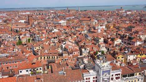 Aerial-tilt-up-from-Piazza-San-Marco-reveals-skyline-of-Venice,-Italy