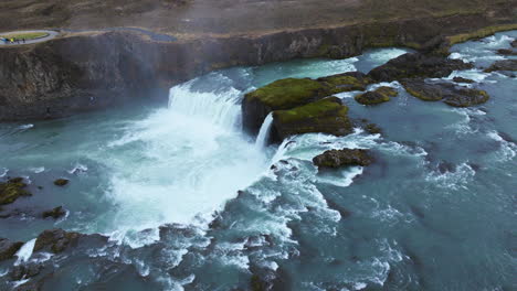 Aerial-View-Over-Glacial-Godafoss-Waterfall-In-Iceland---Drone-Shot