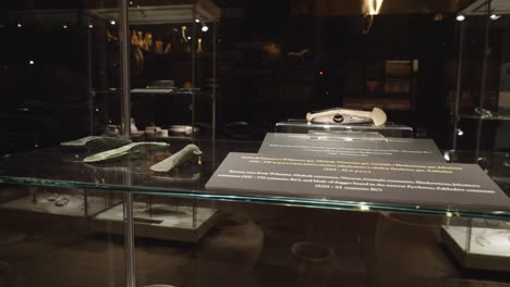 ancient-weapons-in-glass-case-at-the-exhibition-in-the-museum-of-Biskupin,-Poland