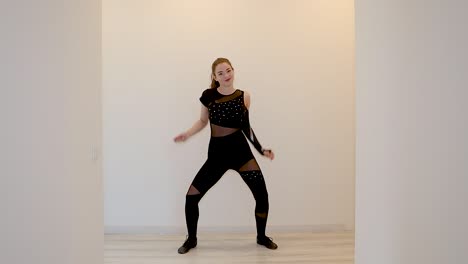 Slow-motion-clip-of-a-dancer-teaching-an-online-dance-class-from-home