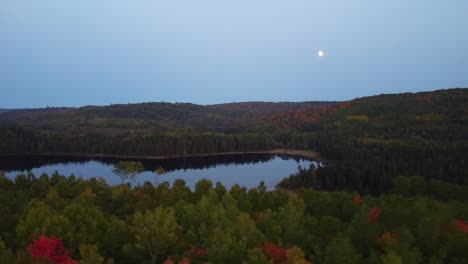 Aerial-wide-view-of-tranquil-Lake-landscape-at-dusk-in-Wildlife-Reserve,-Quebec