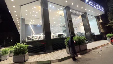 Luxury-car-dealer-store-super-sport-vehicle-in-the-city-life-urban-landscape-driving-in-street-walking-in-pavement-pedestrian-outdoor-activity-outside-home-vacation-holiday-time-travel-Iran-Tehran